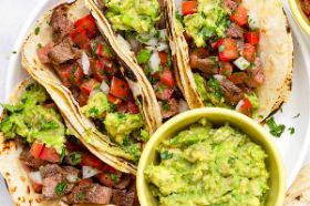 Tacos (three pieces) each one with avocado, tuna, tomatoes inside